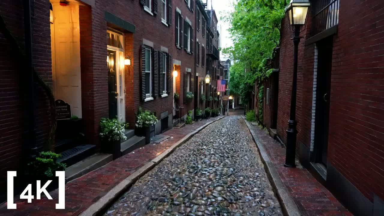 Beacon Hill, Boston at dusk after rain: gas lamps lit above wet cobblestones on Acorn Street
