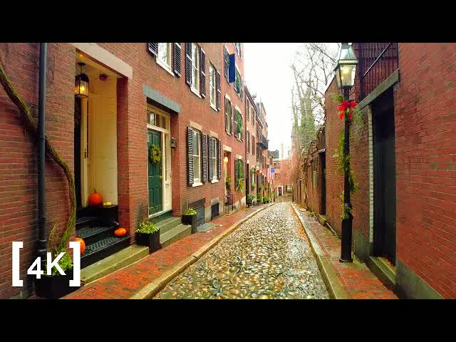 Beacon Hill, Boston at morning in winter rain: a gas lamp trimmed with a red holiday bow above a wet cobblestone lane between brick rowhouses